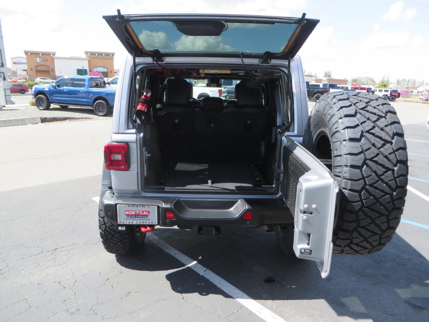 2021 SILVER /BLACK Jeep Wrangler Unlimited Rubicon (1C4HJXFG7MW) with an 3.6L V6 DOHC 24V FFV engine, 6A transmission, located at 2630 Grass Valley Highway, Auburn, CA, 95603, (530) 508-5100, 38.937893, -121.095482 - Features - Zone Offroad 3" Lift kit, Fox shocks, 37" Nitto Ridge Grappler tires, 17" Fuel Piston wheels, Warn winch, KC led lights, Voswitch switches, Teraflex HD tire relocation, Fire extinguisher, High Lift Jack, Shovel, Axe, Jumper Cables, and flat towable. - Photo#60